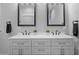 Bathroom vanity with double sinks, gray cabinets, and black hardware at 235 E 11Th St, Indianapolis, IN 46202