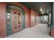 Inviting front porch with beautiful arched entryway and classic brick columns, offering an ideal spot for relaxation at 235 E 11Th St, Indianapolis, IN 46202