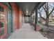 Spacious front porch featuring classic columns and elegant railings. A serene space for outdoor enjoyment and relaxation at 235 E 11Th St, Indianapolis, IN 46202
