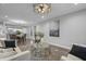 Open-concept living space with modern furnishings and seamless flow to the dining area and kitchen at 235 E 11Th St, Indianapolis, IN 46202