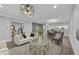 Open-concept living room featuring stylish furnishings and seamless flow to the dining area at 235 E 11Th St, Indianapolis, IN 46202