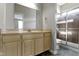 Bright bathroom featuring a large mirror and a walk-in shower at 2605 Carrollton Ave, Indianapolis, IN 46205