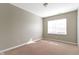 Empty bedroom featuring a window, neutral walls, and carpeted floors at 2605 Carrollton Ave, Indianapolis, IN 46205