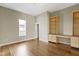 Bright bedroom boasts hardwood floors, a built-in desk, and natural light at 2605 Carrollton Ave, Indianapolis, IN 46205
