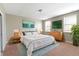 Spacious bedroom featuring two windows and a bed with decorative pillows at 2605 Carrollton Ave, Indianapolis, IN 46205
