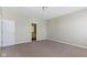 Clean bedroom with a view into the bathroom and neutral carpeting at 2605 Carrollton Ave, Indianapolis, IN 46205