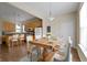 Charming dining area with hardwood table, seating for six, and view of the kitchen at 2605 Carrollton Ave, Indianapolis, IN 46205