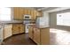 Well-equipped kitchen with an island, light wood cabinets, and modern appliances at 2605 Carrollton Ave, Indianapolis, IN 46205
