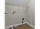 Small laundry room with tile floors and shelving at 2605 Carrollton Ave, Indianapolis, IN 46205