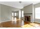 Living room featuring hardwood floors, a fireplace, and natural light at 2605 Carrollton Ave, Indianapolis, IN 46205