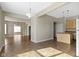 Open-concept living space with tile and wood floors, bright lighting, and neutral tones at 2605 Carrollton Ave, Indianapolis, IN 46205