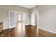 Spacious room with hardwood floors, neutral walls, and ample natural light at 2605 Carrollton Ave, Indianapolis, IN 46205