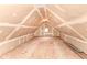 Spacious attic with unfinished walls, plywood floor, and natural light at 2914 N Delaware N St, Indianapolis, IN 46205