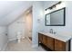 Bathroom with patterned tile flooring and a shower with stone flooring, and an enclosed toilet area at 2914 N Delaware N St, Indianapolis, IN 46205