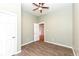 Bedroom featuring wood flooring and neutral paint with an open doorway at 2914 N Delaware N St, Indianapolis, IN 46205