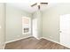 Bedroom features neutral paint, wood floors, and natural light at 2914 N Delaware N St, Indianapolis, IN 46205