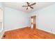Spacious bedroom with wood flooring, ceiling fan, and a connecting room at 2914 N Delaware N St, Indianapolis, IN 46205
