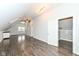 Finished bonus room with wood floors, skylights, built-in storage, and closet at 2914 N Delaware N St, Indianapolis, IN 46205