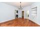 Open dining room with hardwood floors, a chandelier, and access to other rooms, perfect for entertaining guests at 2914 N Delaware N St, Indianapolis, IN 46205