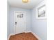Bright foyer with a white door, tile flooring, and a window, creating a clean and welcoming entry space at 2914 N Delaware N St, Indianapolis, IN 46205