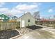 Detached one-car garage with a side door, a window, and an easy-to-maintain yard at 2914 N Delaware N St, Indianapolis, IN 46205