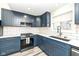 This remodeled kitchen features stainless steel appliances, a gas range and white backsplash at 2914 N Delaware N St, Indianapolis, IN 46205