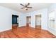 Hardwood floors, ceiling fan, and open access to other rooms make this living room perfect for hosting gatherings at 2914 N Delaware N St, Indianapolis, IN 46205