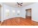 Spacious living room with hardwood floors, large windows, and neutral wall color at 2914 N Delaware N St, Indianapolis, IN 46205