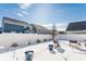 A home's fenced backyard in winter with snow-covered ground and sunny blue sky at 5303 Brandywine Dr, Whitestown, IN 46075