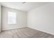 Bright bedroom with neutral walls, carpet, and a window with blinds at 5303 Brandywine Dr, Whitestown, IN 46075