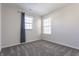 Bright bedroom with neutral walls, carpet, and a large window with stylish curtains at 5303 Brandywine Dr, Whitestown, IN 46075