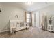 Bright and cheerful bedroom featuring a crib and modern accents at 5303 Brandywine Dr, Whitestown, IN 46075