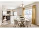 Bright dining area with a modern table, stylish chairs, and natural light at 5303 Brandywine Dr, Whitestown, IN 46075
