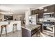 Open kitchen view into the living area, featuring stainless appliances and a center island at 5303 Brandywine Dr, Whitestown, IN 46075