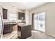 Functional kitchen featuring dark cabinets, stone countertops, and a center island at 5303 Brandywine Dr, Whitestown, IN 46075