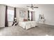 Bright and airy main bedroom with large windows, ceiling fan and decorative accents at 5303 Brandywine Dr, Whitestown, IN 46075