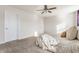 Spacious main bedroom featuring neutral color palettes and a ceiling fan at 5303 Brandywine Dr, Whitestown, IN 46075