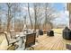 Back deck featuring plenty of outdoor seating, string lights, and an umbrella at 5815 Noble Dr, Indianapolis, IN 46234