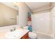 Bathroom featuring a shower and tub combo, light walls, and a wood vanity at 5815 Noble Dr, Indianapolis, IN 46234