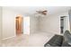 Bedroom featuring neutral carpet, ceiling fan, and two doorways for easy access at 5815 Noble Dr, Indianapolis, IN 46234