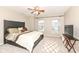 Bedroom with neutral carpet and walls, ceiling fan, and windows for plenty of natural light at 5815 Noble Dr, Indianapolis, IN 46234