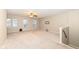 Large bonus room with neutral paint, natural light, and access to the upper floor at 5815 Noble Dr, Indianapolis, IN 46234