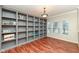 Bright home office with custom built-in shelving and hardwood floors at 5815 Noble Dr, Indianapolis, IN 46234