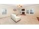 Bright and open living room with a cozy fireplace and neutral tones at 5815 Noble Dr, Indianapolis, IN 46234