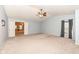 Bright and airy main bedroom featuring neutral paint, vaulted ceilings, and doors leading to other rooms at 5815 Noble Dr, Indianapolis, IN 46234