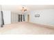 Spacious main bedroom featuring vaulted ceilings, ceiling fan, neutral carpet and paint, and several windows at 5815 Noble Dr, Indianapolis, IN 46234