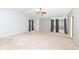 Large main bedroom featuring a vaulted ceiling, neutral color palette, and several windows with dark draperies at 5815 Noble Dr, Indianapolis, IN 46234