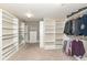 Spacious walk-in closet with custom shelving and closet rods for plenty of storage options at 5815 Noble Dr, Indianapolis, IN 46234