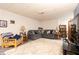 Finished basement with gray sectional, neutral walls and carpet, and accent furniture at 6006 Regency Dr, Columbus, IN 47203