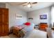 Bedroom featuring neutral walls, ceiling fan and large closet storage at 6006 Regency Dr, Columbus, IN 47203